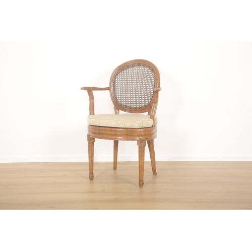 283 - A SET OF FIVE FRENCH CANED AND GRAINED BEECHWOOD ARMCHAIRS

20th Century, the oval concave backs wit... 