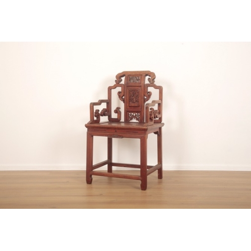 301 - A CHINESE HARDWOOD ARMCHAIR CHAIR

with scrolled back rail and stepped arms, the back splat with a c... 