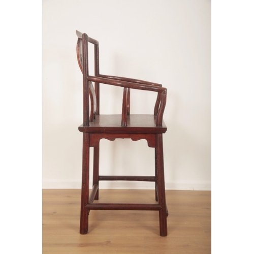 302 - A CHINESE HARDWOOD ARMCHAIR

with yoke back rail and curvaceous arms, curved splat carved with a vil... 