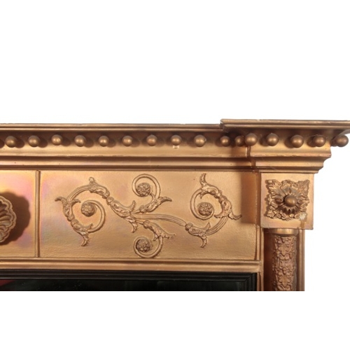 329 - A GILTWOOD OVERMANTEL MIRROR IN REGENCY STYLE

19th century and later, with breakfront cornice, ball... 