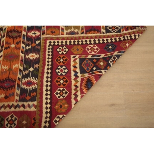 347 - A QASHGAI KILIM

woven in colours with geometric motifs within a cruciform border, 280cm long x 150c... 