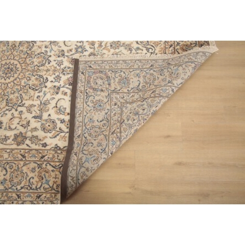 349 - A KASHAN CARPET

woven in blue and tan with central double headed floral medallion, spandrels and fi... 