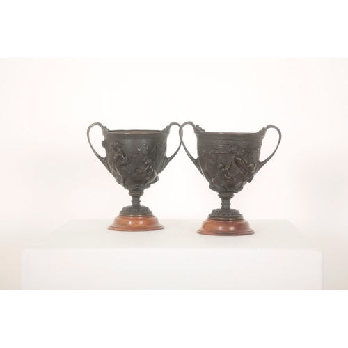 98 - A PAIR OF BRONZE URNS WITH SCROLLED HANDLES

mid-19th century, possibly Elkington & Co. (without sta... 