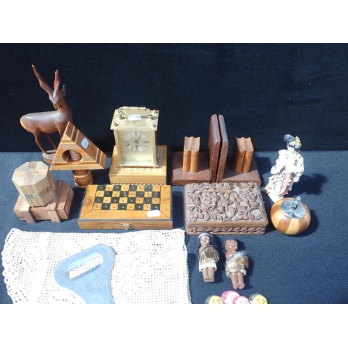 105 - A CARVED WOODEN BOX, A TRAVEL CHESS SET table lighter and sundries