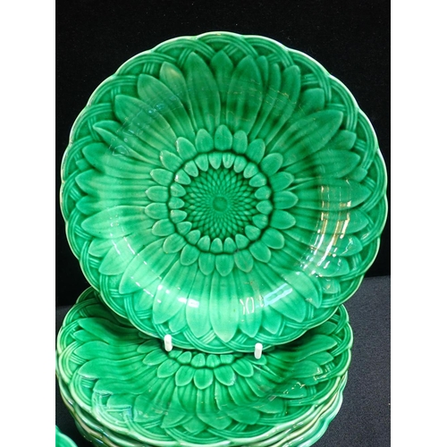 143 - FIFTEEN WEDGWOOD GREEN-GLAZED DESSERT PLATES, SUNFLOWER PATTERN with basket weave border, and a matc... 