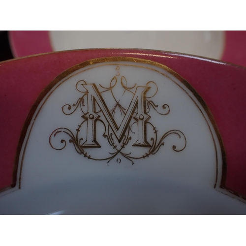 147 - A LATE 19th CENTURY PARIS PART DINNER SERVICE with a pink rim and a monogram 