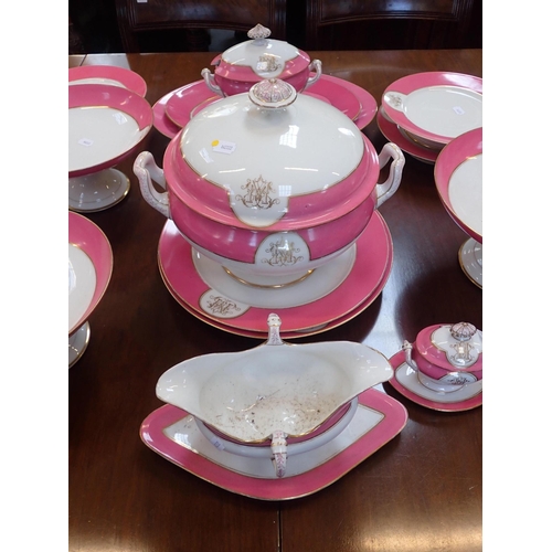 147 - A LATE 19th CENTURY PARIS PART DINNER SERVICE with a pink rim and a monogram 