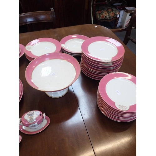 147 - A LATE 19th CENTURY PARIS PART DINNER SERVICE with a pink rim and a monogram 