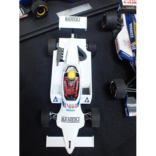 181 - NIGEL MANSELL AND AYRTON SENNA: THE 1991 BRITISH GRAND PRIX 'TAXI' a Minichamps model of the famous ... 