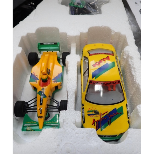 207 - A SCALEXTRIC FORMULA AYRTON SENNA SET: TEAM BRASIL F1038 including three cars (one original, one lat... 