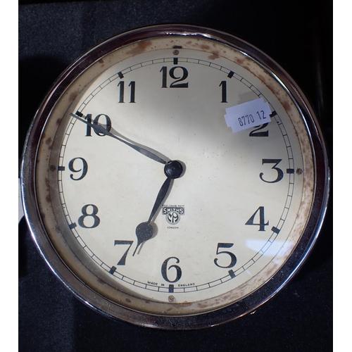 215 - FIVE CLOCKS, INCLUDING A SMITHS BULKHEAD CLOCK two Bakelite clocks, a 'Napoleon Hat' clock with West... 