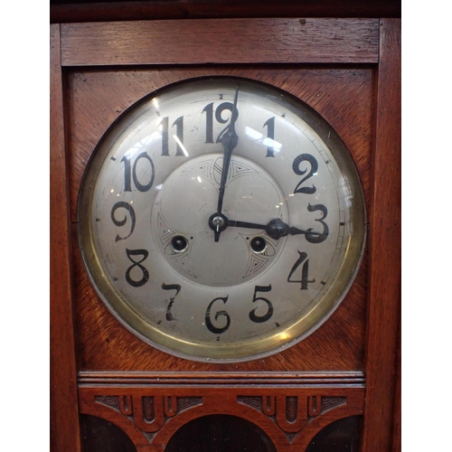 216 - A 1920s WALNUT CASED WALL CLOCK with silvered dial, striking on rods, 82cm long approx, and an oak c... 