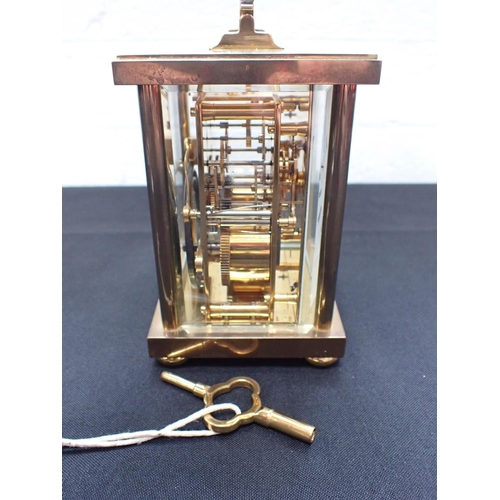 217 - A MATTHEW NORMAN BRASS CARRIAGE CLOCK striking on a gong (running)