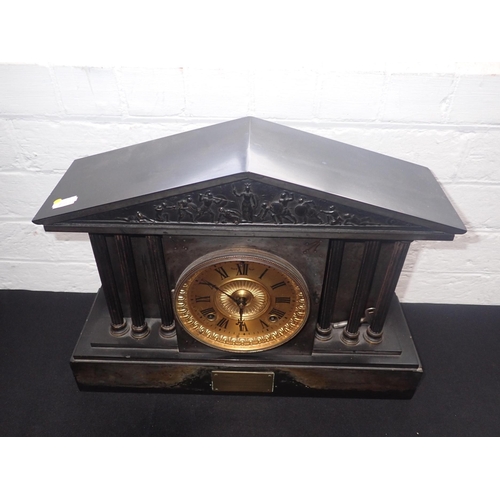 218 - A SLATE-CASED MANTEL CLOCK, OF TEMPLE FORM with Ansonia movement striking on a gong; 'Presented to C... 