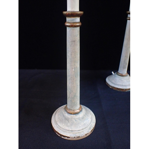 226 - A PAIR OF PAINTED CANDLESTICK STYLE TABLE LAMPS with distressed gilding (for re-wiring)