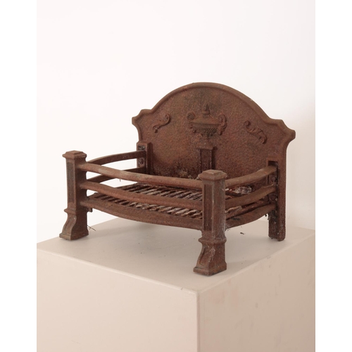 23 - A CAST IRON FIRE BASKET decorated with classical motifs, the bow fronted body on fluted column legs,... 