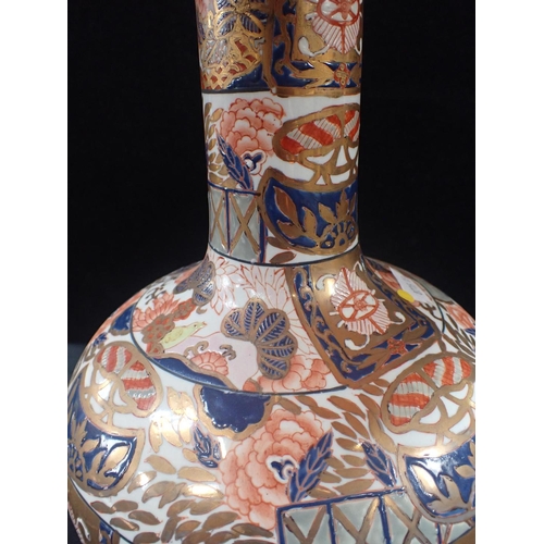 230 - AN IMARI STYLE BOTTLE VASE LAMP heavily painted and gilt 32cm high plus fittings and stand