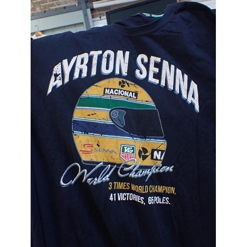 237 - AN AYRTON SENNA RUCKSACK red embroidery on black, containing a Nacional baseball cap and two Ayrton ... 