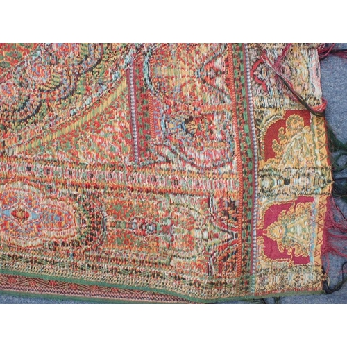 284 - AN ANTIQUE WOOLLEN PAISLEY 'CRINOLINE' SHAWL with fringe, approx 330 x 167cm (some marks, but appear... 