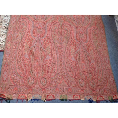 284 - AN ANTIQUE WOOLLEN PAISLEY 'CRINOLINE' SHAWL with fringe, approx 330 x 167cm (some marks, but appear... 