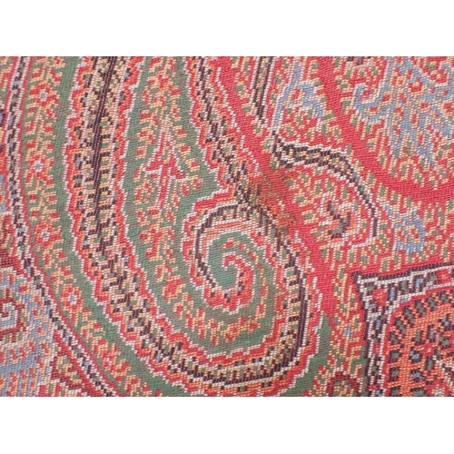 284 - AN ANTIQUE WOOLLEN PAISLEY 'CRINOLINE' SHAWL with fringe, approx 330 x 167cm (some marks, but appear... 