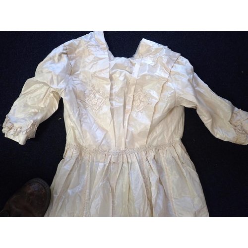 285 - A MID VICTORIAN CREAM SILK DRESS with embroidery decoration