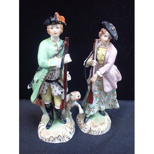 305 - A PAIR OF DRESDEN HUNTING FIGURES of 18th century style, approx 15cm high, a Volkstadt blue, white a... 