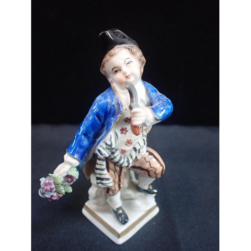 307 - A PAIR OF GDR SITZENDORF PORCELAIN FIGURES OF GRAPE HARVESTERS 11cm high