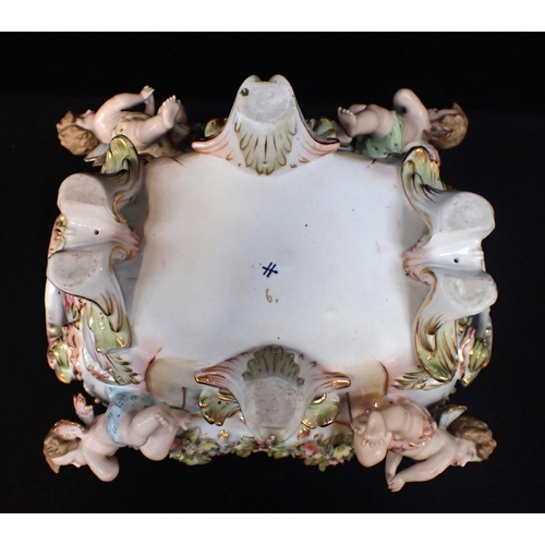 317 - A MEISSEN STYLE CONTINENTAL JARDINIERE painted and encrusted with flowers and putti 35cm wide (small... 