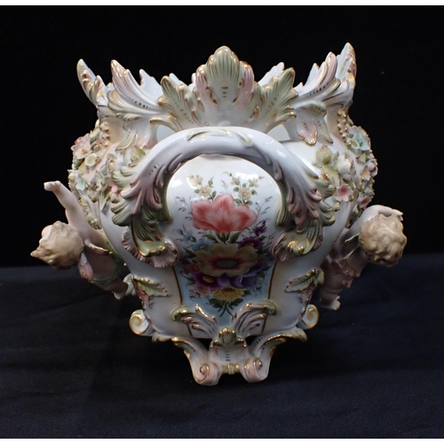 317 - A MEISSEN STYLE CONTINENTAL JARDINIERE painted and encrusted with flowers and putti 35cm wide (small... 