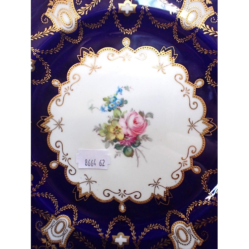 329 - A PAIR OF ROYAL CROWN DERBY PLATES WITH FLORAL CENTRES and cobalt and gilt borders, retailed by Phil... 