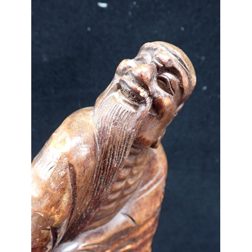 356 - A CHINESE CARVED BAMBOO FIGURE OF CLOAKED LOHAN 44cm high, including base