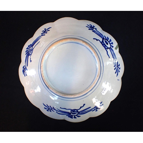 357 - A JAPANESE IMARI DISH WITH LOBED RIM and typical decoration 30.5cm dia (wear to gilt)