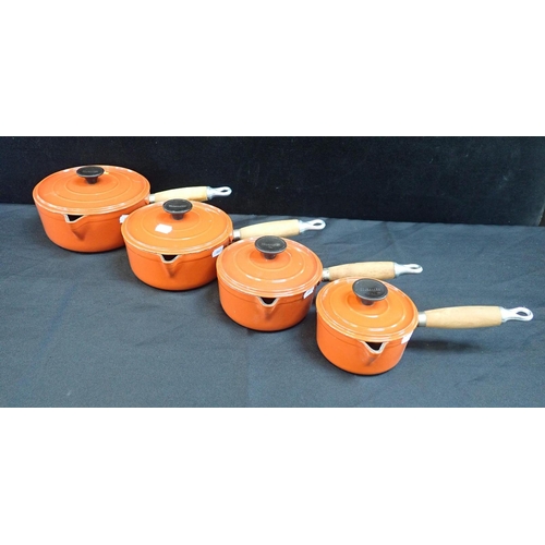 40 - A SET OF CAST IRON GRADUATED COUSANCES SAUCEPANS orange (4)