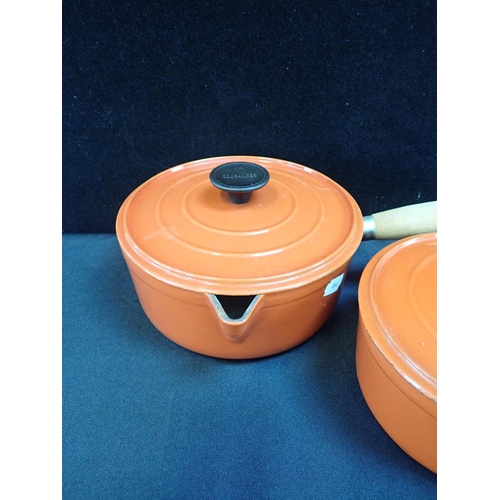 40 - A SET OF CAST IRON GRADUATED COUSANCES SAUCEPANS orange (4)