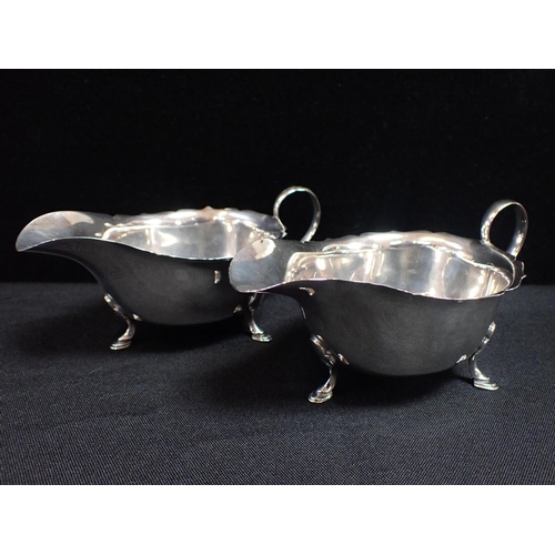 400 - A PAIR OF SILVER SAUCE BOATS, A PAIR OF LADLES a silver toast rack and other small silver