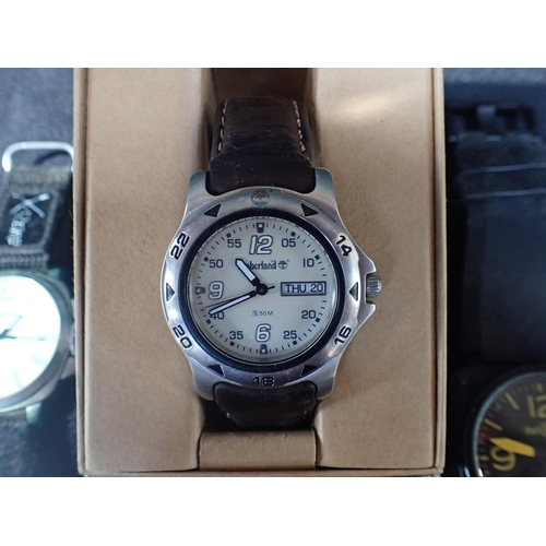 415 - A COLLECTION OF QUARTZ WATCHES including a boxed Timberland example