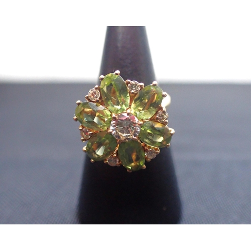 420 - AN 18ct GOLD DRESS RING, SET WITH THREE STONES and another with flower head setting (2)