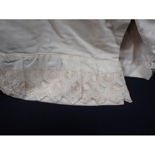 64 - AN EDWARDIAN CHILDS' CAPE with lace trim and ribbon fastening (ribbon a/f)