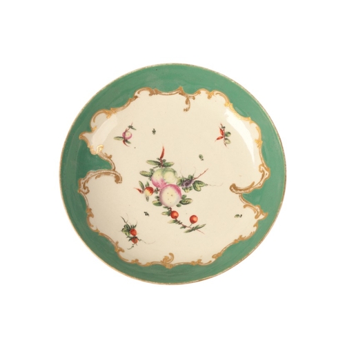 10 - A WORCESTER PORCELAIN SAUCER DISH

circa 1770, the shaped pea-green border outlined with gilt scroll... 