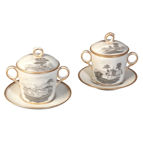 27 - A PAIR OF WORCESTER PORCELAIN CHOCOLATE CUPS, COVERS AND STANDS

early 19th century, decorated en gr... 