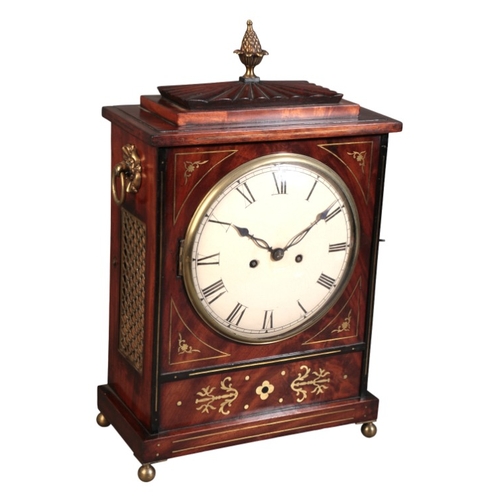 298 - A REGENCY MAHOGANY AND BRASS INLAID BRACKET CLOCK

the double fusee eight day movement striking on a... 