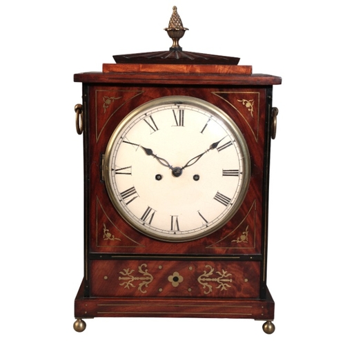 298 - A REGENCY MAHOGANY AND BRASS INLAID BRACKET CLOCK

the double fusee eight day movement striking on a... 