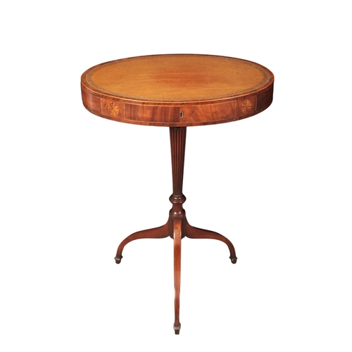 305 - A LATE GEORGE III MAHOGANY LIBRARY DRUM TABLE

the oval top inset with a gilt tooled leather surface... 