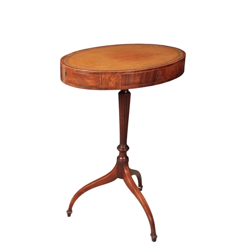 305 - A LATE GEORGE III MAHOGANY LIBRARY DRUM TABLE

the oval top inset with a gilt tooled leather surface... 