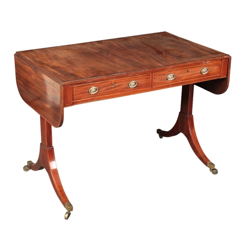 306 - A REGENCY MAHOGANY AND SATINWOOD CROSSBANDED SOFA TABLE

the rectangular drop flap with rounded corn... 