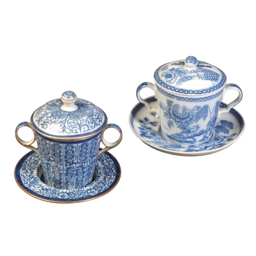 31 - TWO SIMILAR BLUE AND WHITE PORCELAIN CHOCOLATE CUPS, COVERS AND STANDS

early 19th century, both wit... 