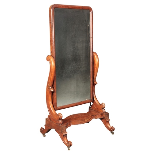 368 - A VICTORIAN WALNUT CHEVAL MIRROR

the rectangular plate within a cushion border held on scrolled sup... 