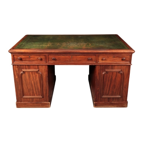 394 - A VICTORIAN MAHOGANY PEDESTAL DESK

the rectangular top inset with a gilt tooled leather writing sur... 