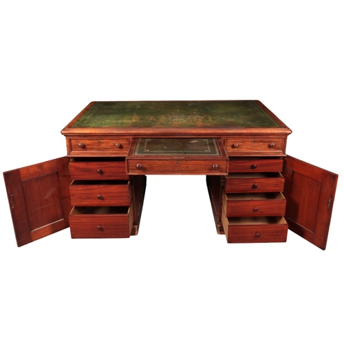 394 - A VICTORIAN MAHOGANY PEDESTAL DESK

the rectangular top inset with a gilt tooled leather writing sur... 